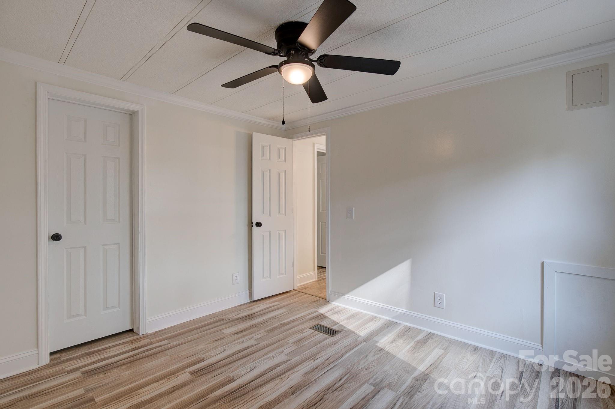 4282 Fred Gardner Road Kershaw, SC 29067 - Photo 31 of 36 a view of empty room with wooden floor