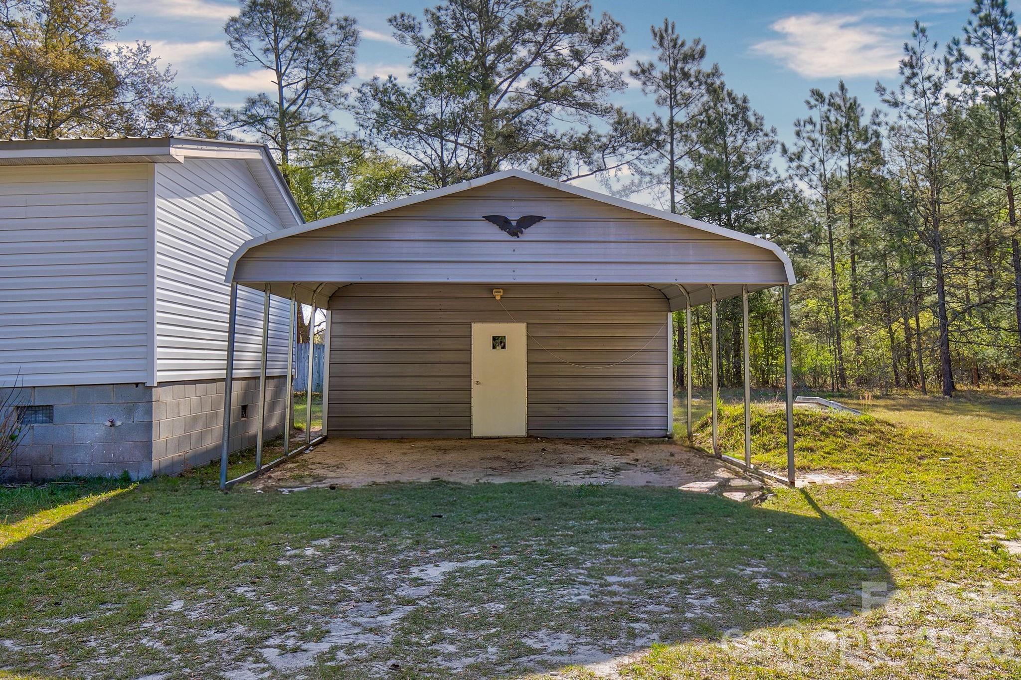 4282 Fred Gardner Road Kershaw, SC 29067 - Photo 32 of 36 a front view of a house with a yard