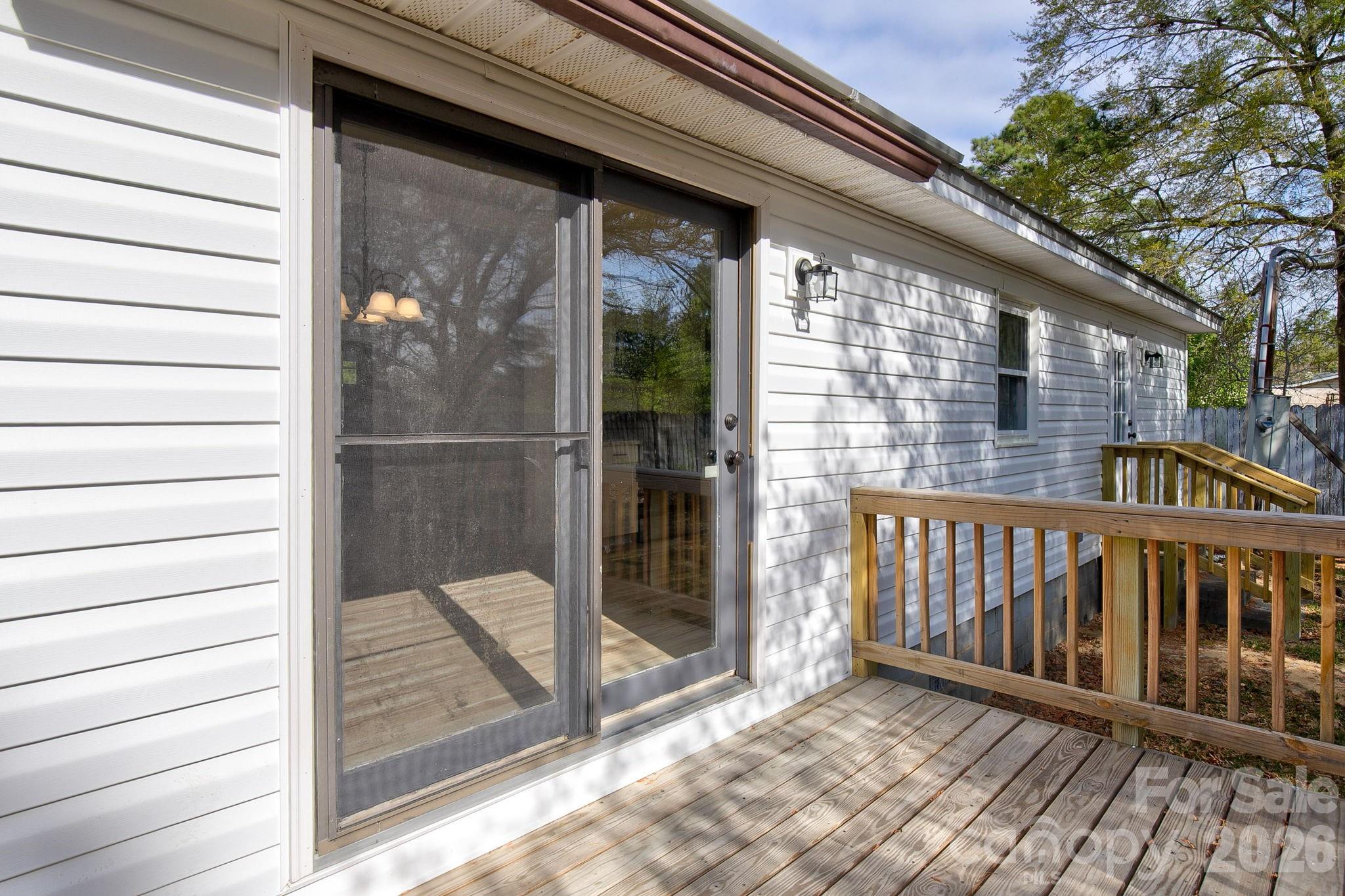 4282 Fred Gardner Road Kershaw, SC 29067 - Photo 33 of 36 a view of a balcony with a potted plant