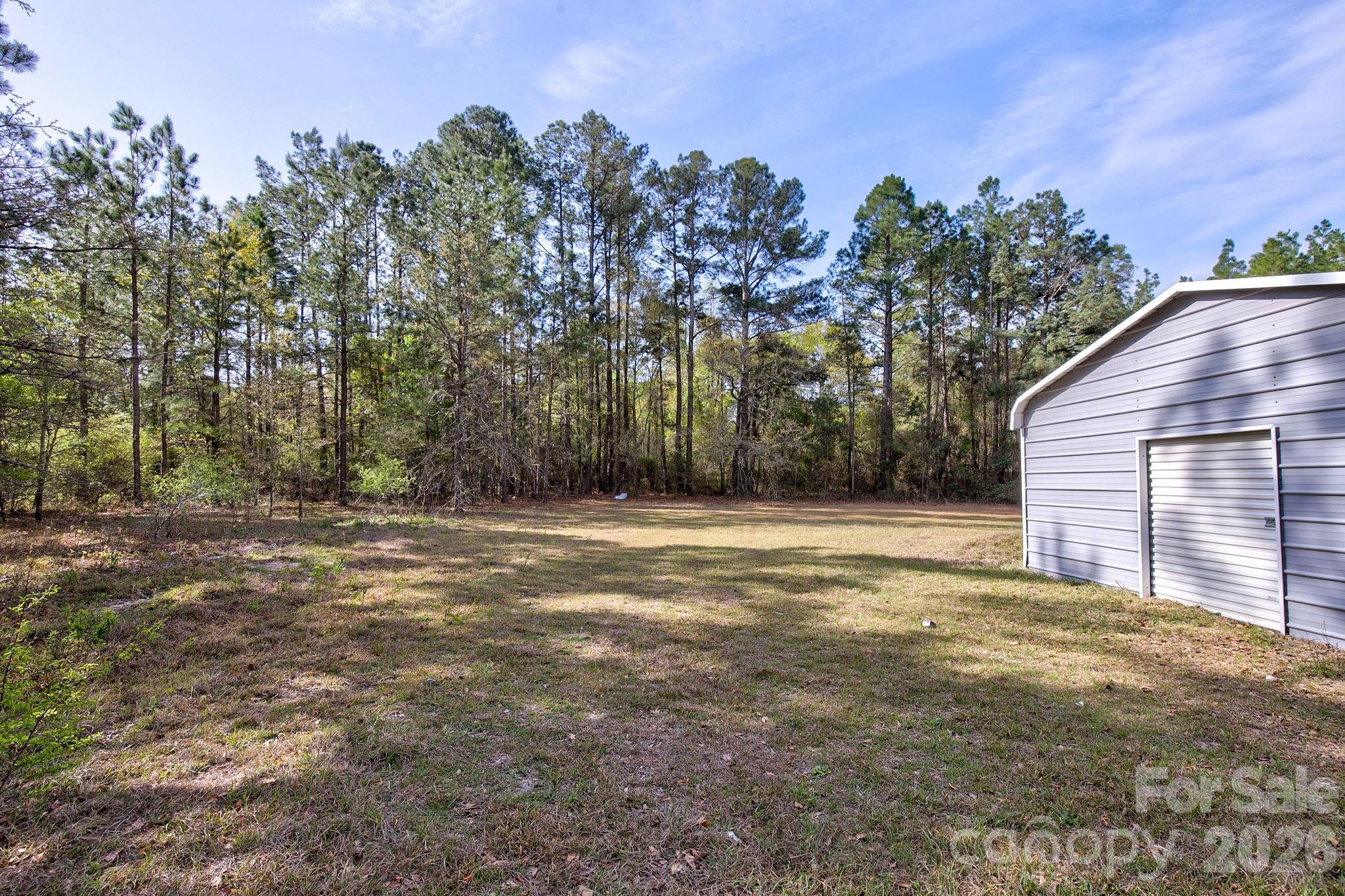 4282 Fred Gardner Road Kershaw, SC 29067 - Photo 35 of 36 a backyard of a house with lots of green space