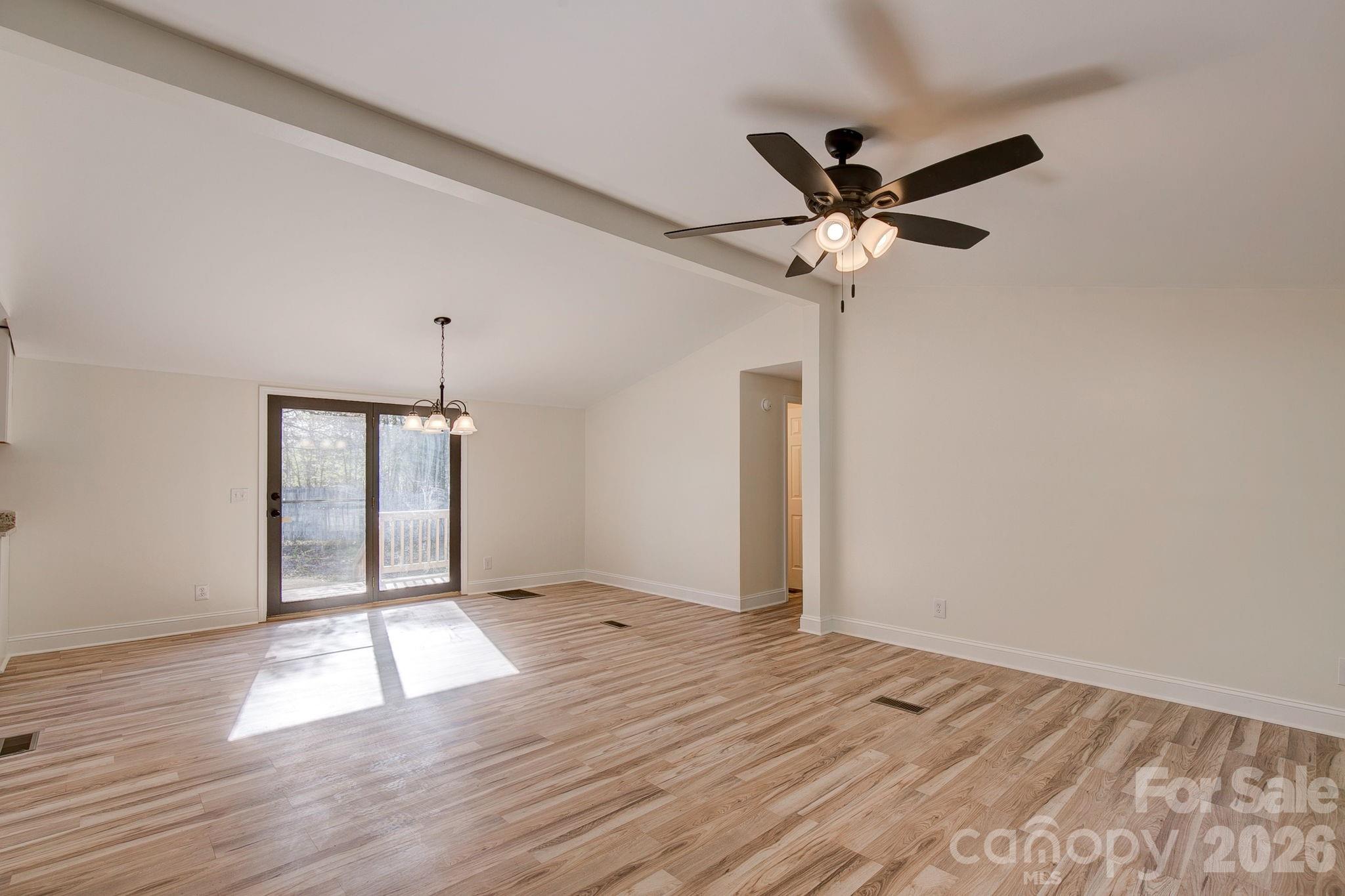 4282 Fred Gardner Road Kershaw, SC 29067 - Photo 4 of 36 a view of empty room with wooden floor and fan