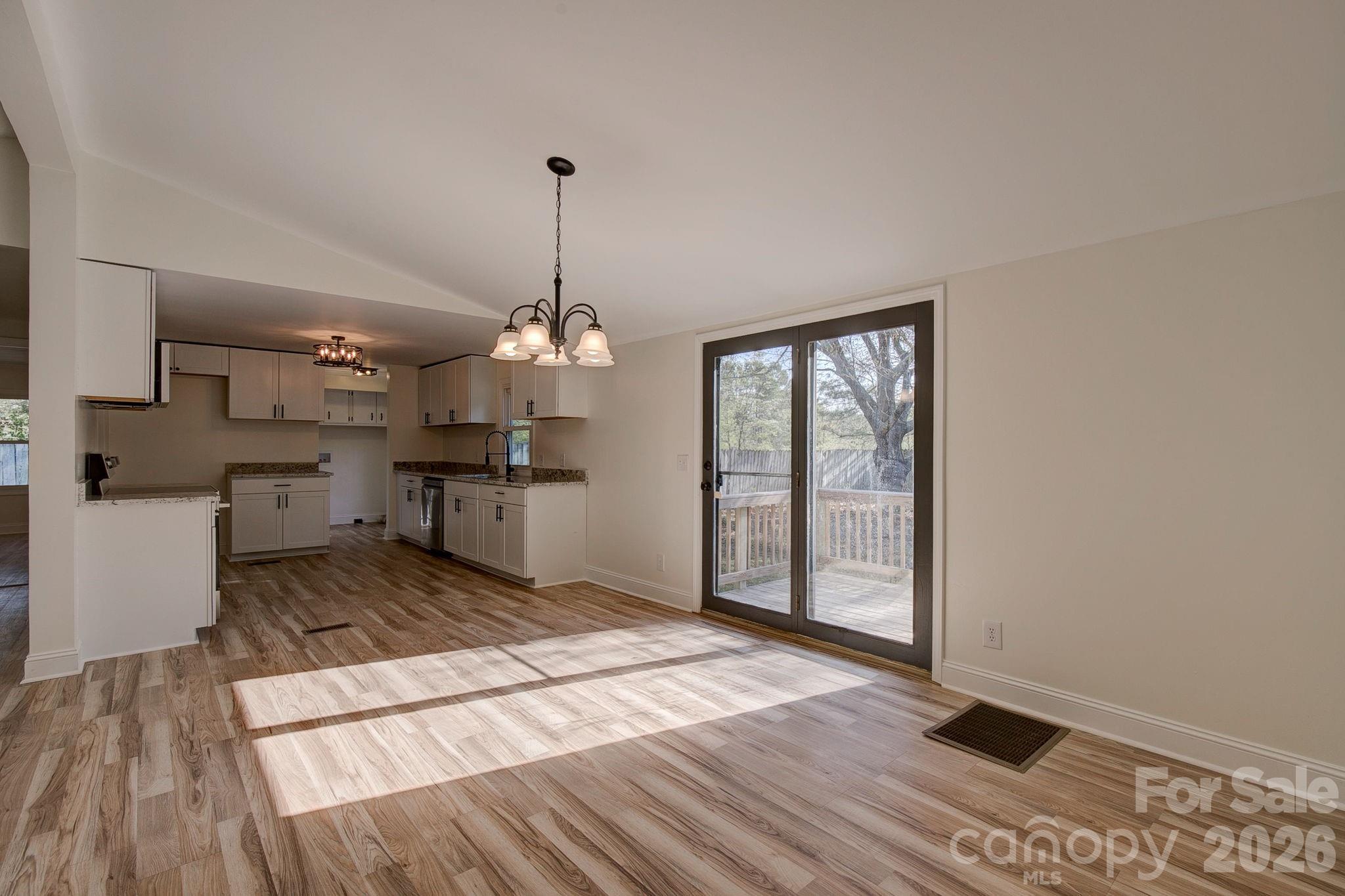 4282 Fred Gardner Road Kershaw, SC 29067 - Photo 10 of 36 a view of a room with wooden floor kitchen view and a window