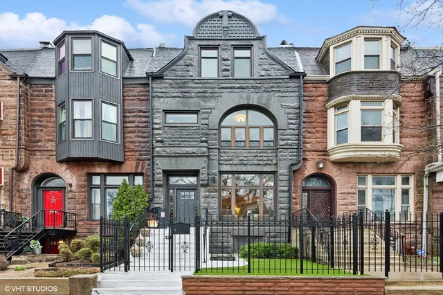 a front view of a house with glass windows