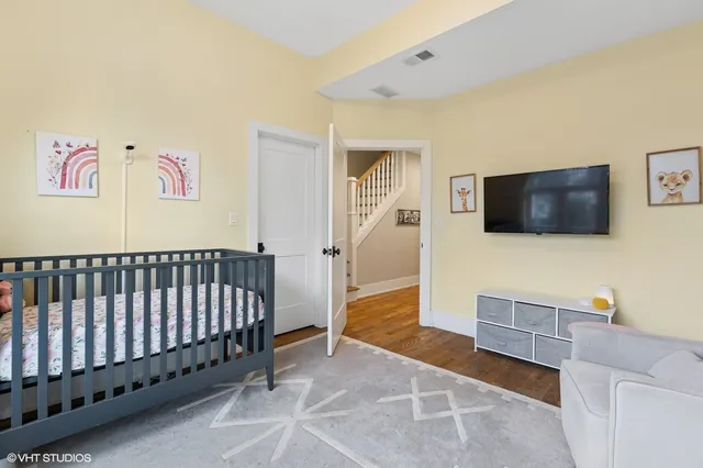a view of a livingroom with furniture and a flat screen tv