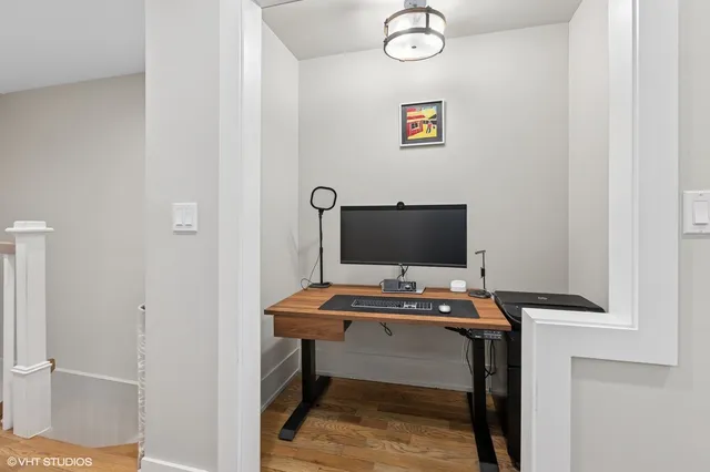 a view of a workspace with furniture