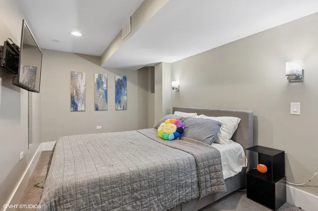 a bedroom with a bed and a tv