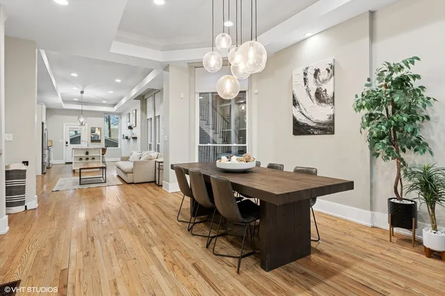 a view of a dining room with furniture and wooden floor