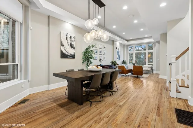 a view of a dining room with furniture window and wooden floor