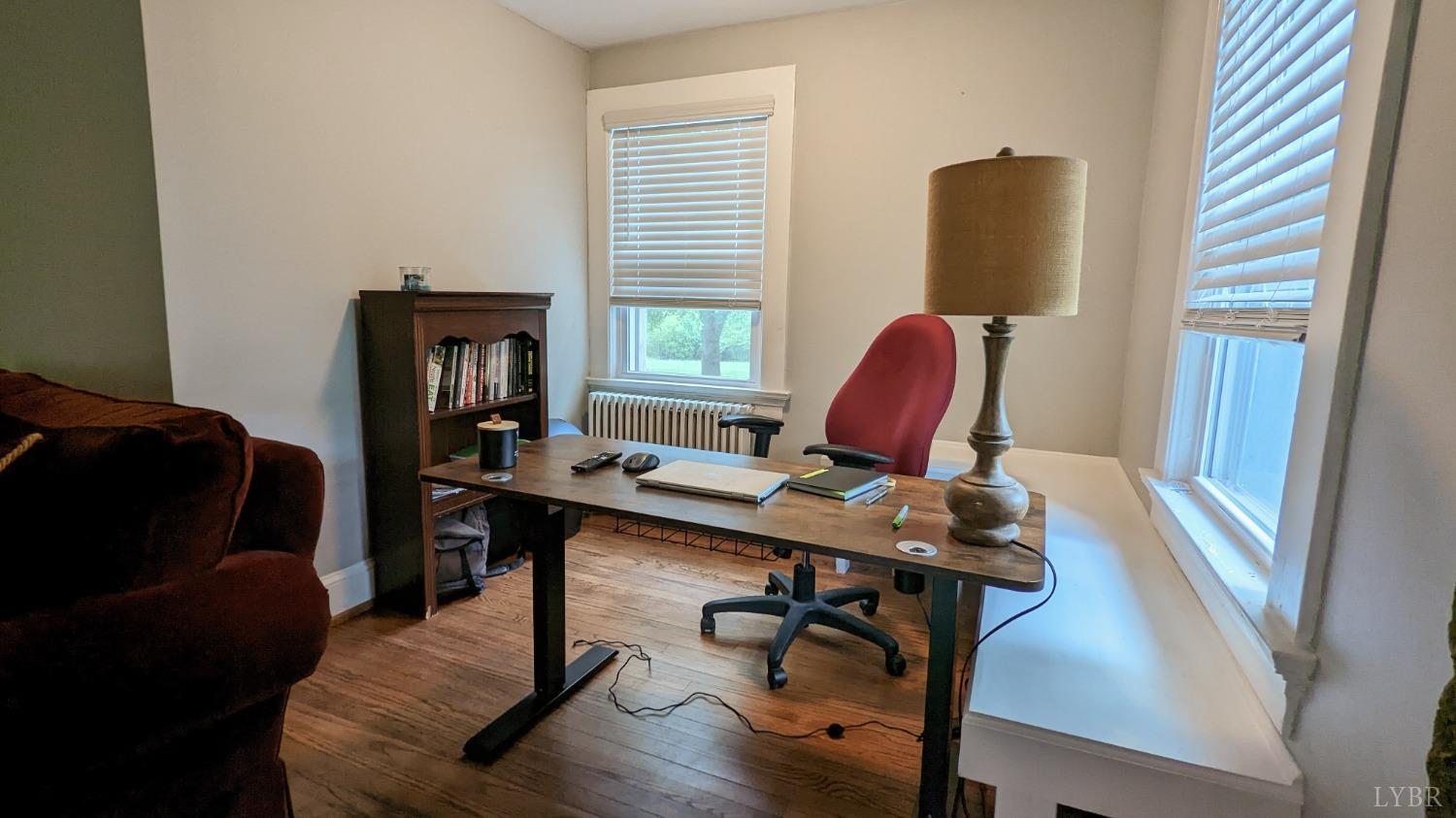 2245 Cedar Gate Road Madison Heights, VA 24572 - Photo 4 of 17 a view of a workspace with furniture and a window