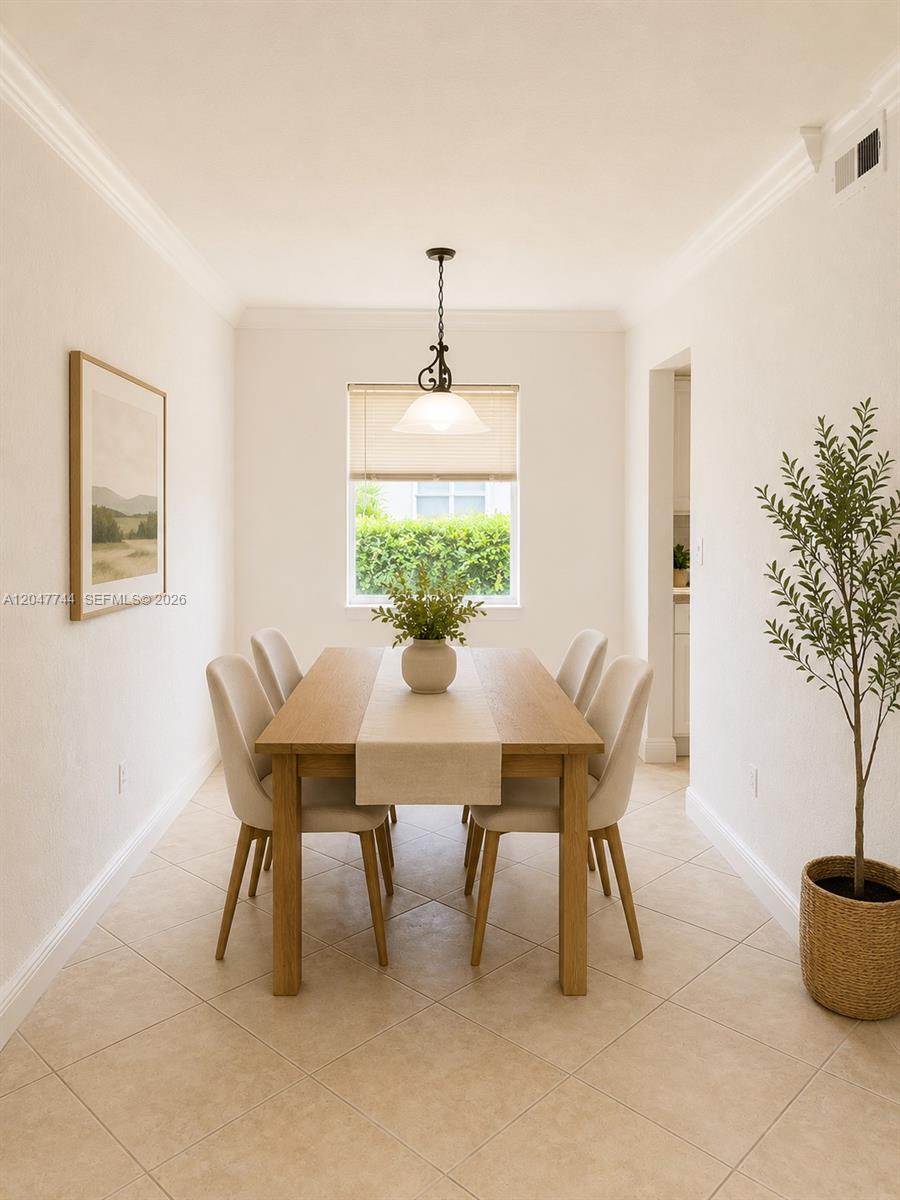 8601 Southwest 94th Street, Unit 105W Miami, FL 33156 - Photo 15 of 24 Staged dinning room