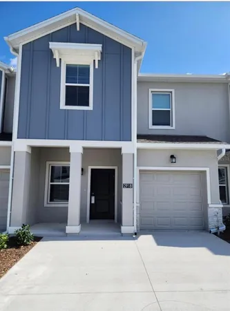 a front view of a house with a garage