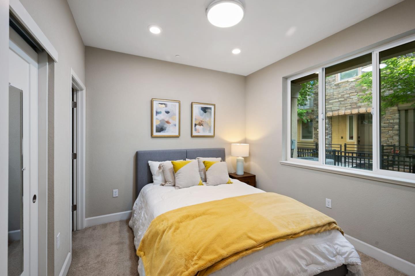 5977 Larkstone Loop San Jose, CA 95123 - Photo 39 of 63 a bedroom with a bed and a large window