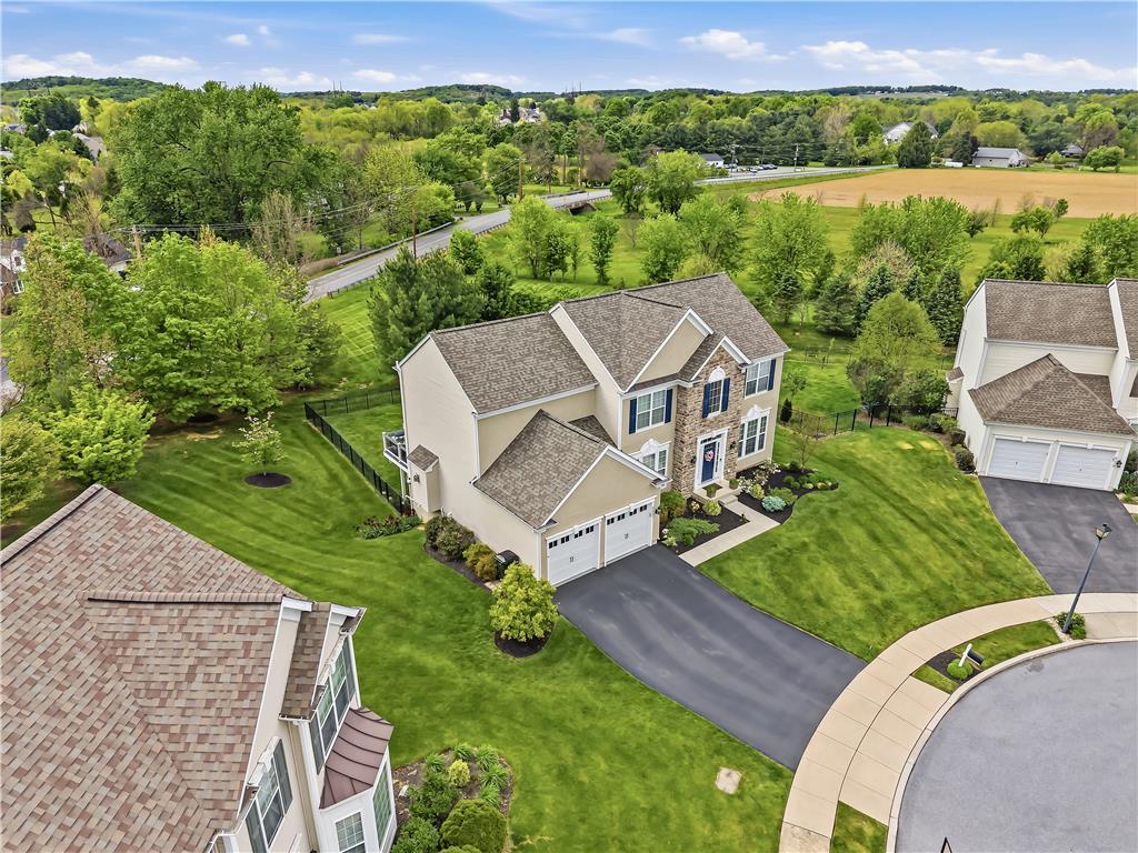 9031 Pathfinder Road Breinigsville, PA 18031 - Photo 3 of 63 An aerial perspective showcases the well-maintained lawn and cul-de-sac access of this attractive residence.