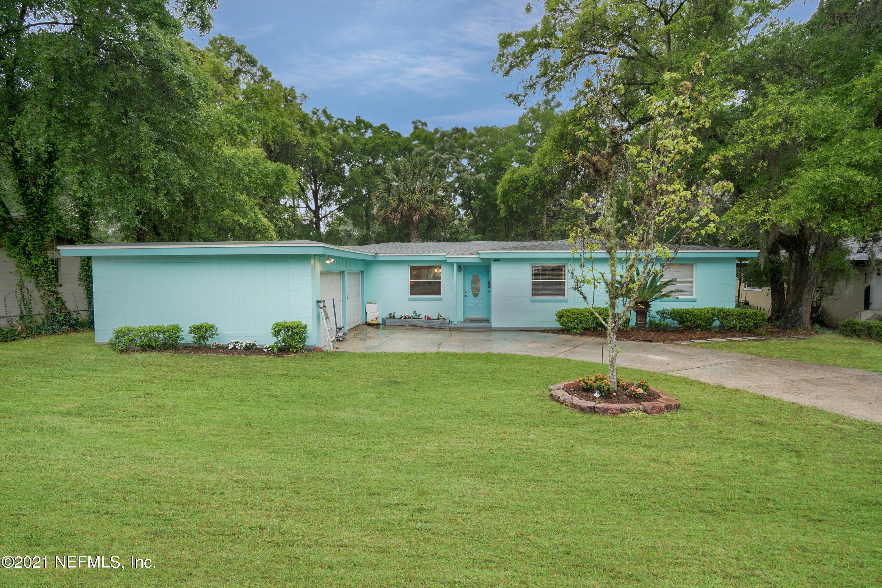 4004 Rogero Road Jacksonville, FL 32277 - Photo 1 of 19 a front view of house with yard and outdoor seating