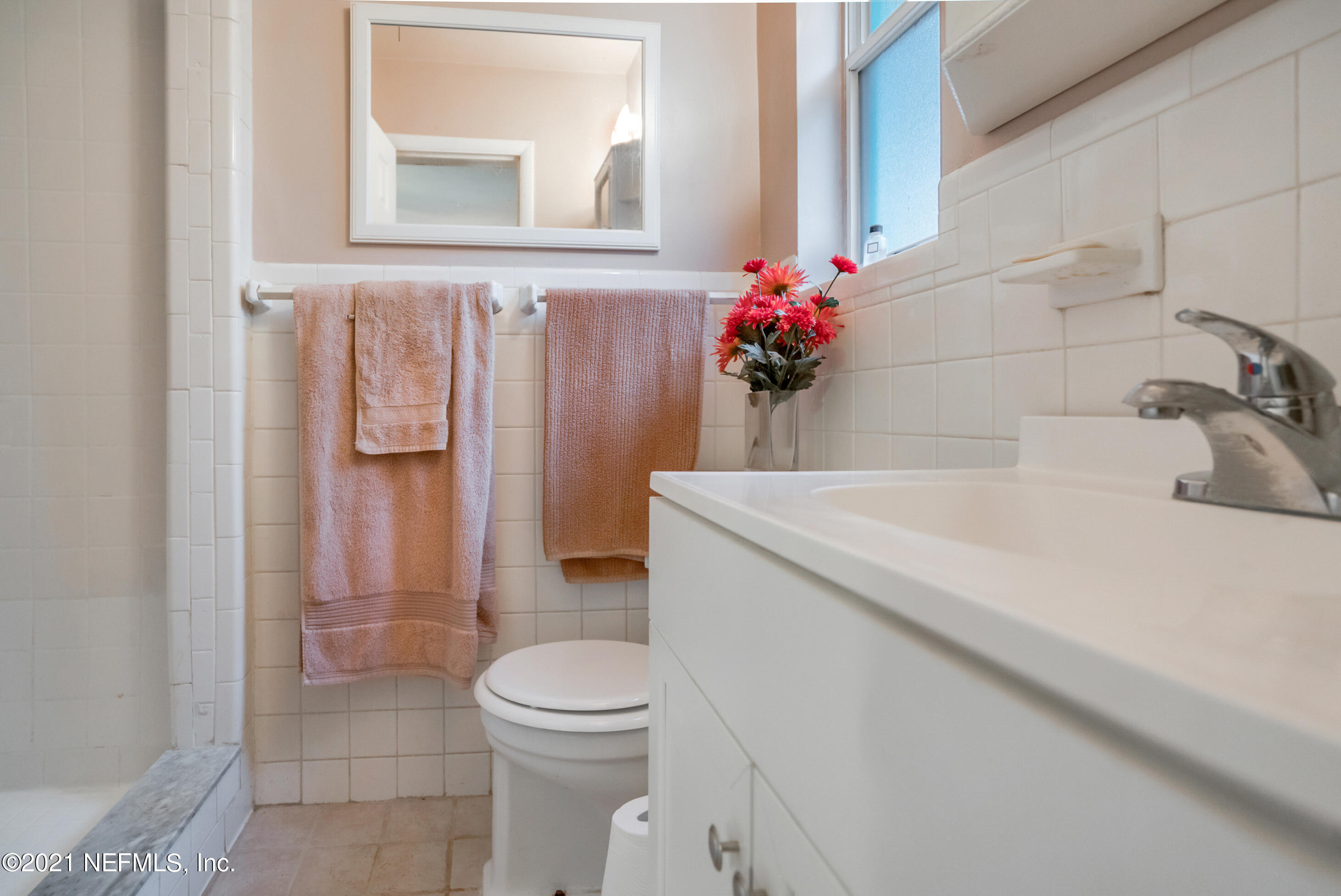 4004 Rogero Road Jacksonville, FL 32277 - Photo 15 of 19 a bathroom with a sink a toilet and shower