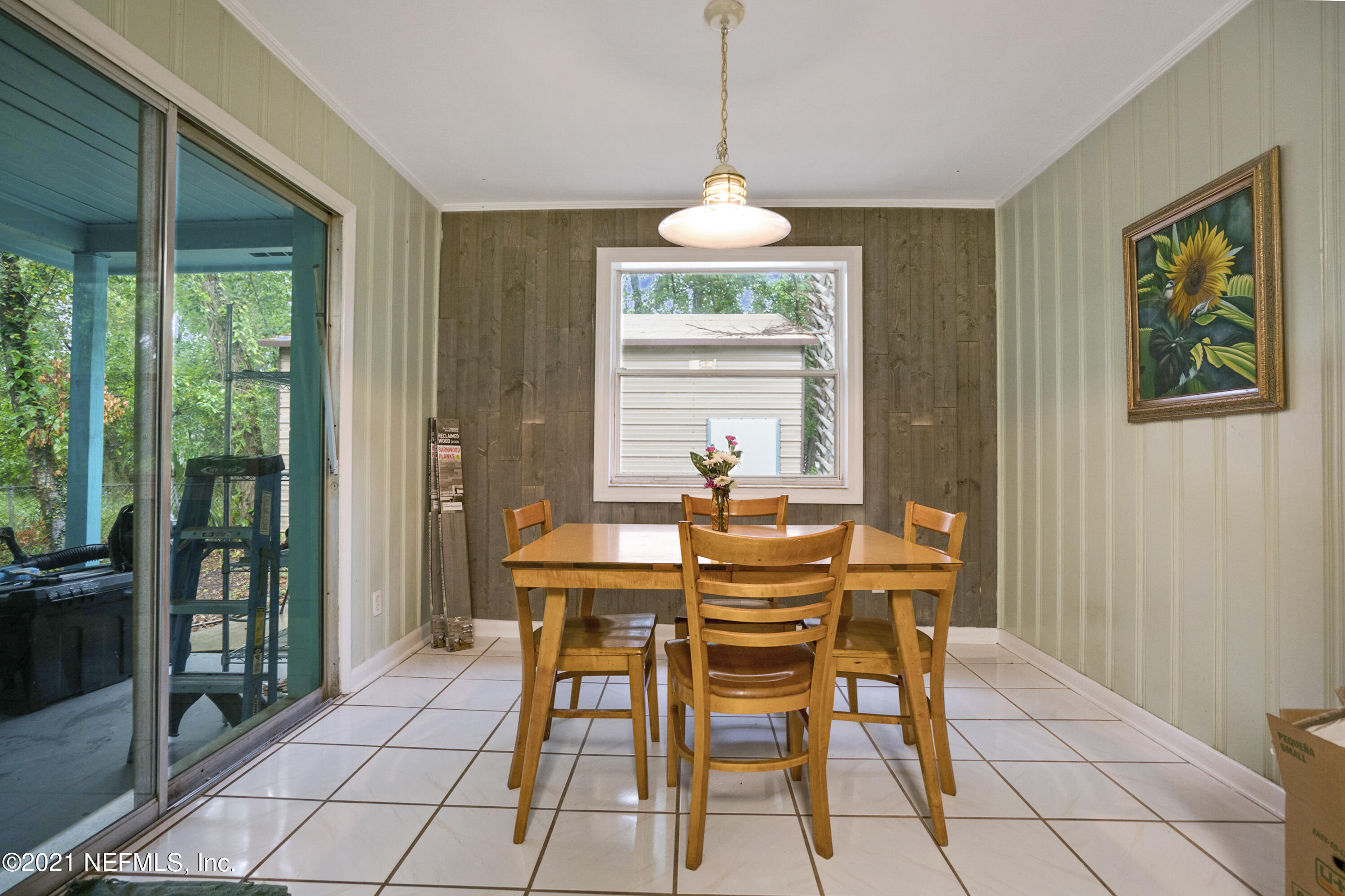 4004 Rogero Road Jacksonville, FL 32277 - Photo 10 of 19 a view of a dining room with furniture window and outside view