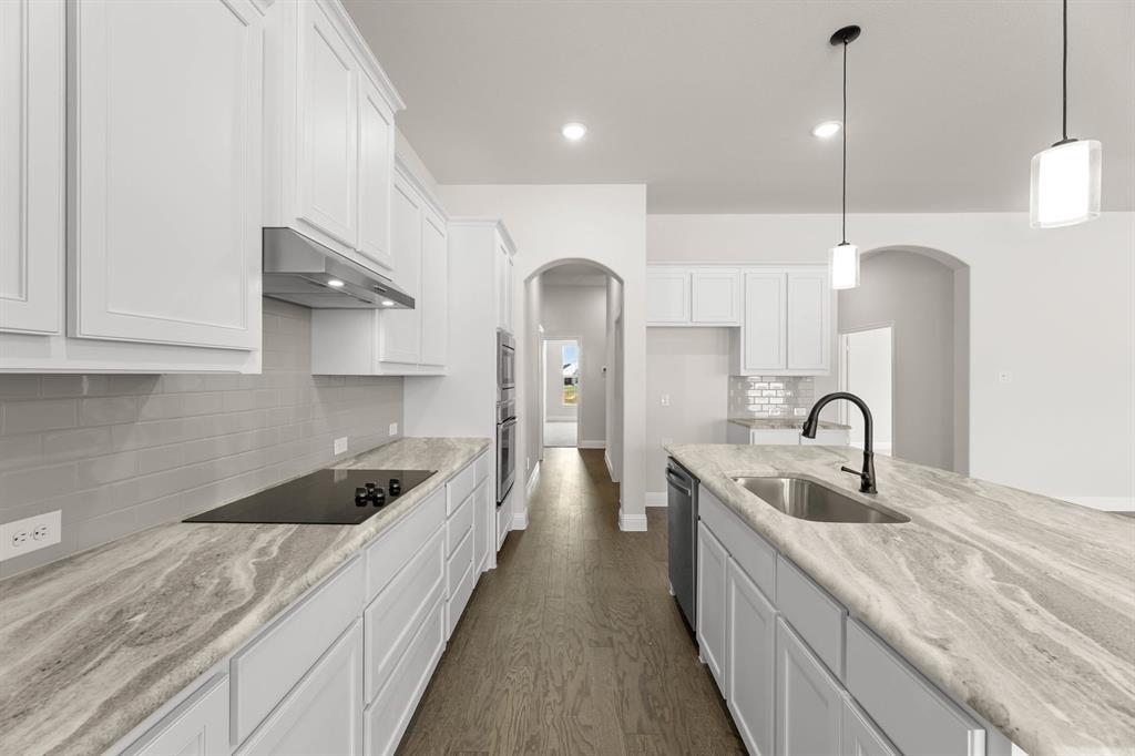35 Magpie Street Joshua, TX 76058 - Photo 2 of 19 a kitchen with a sink and cabinets