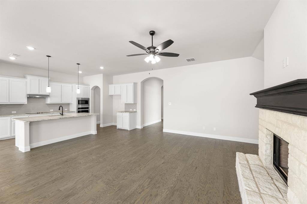 35 Magpie Street Joshua, TX 76058 - Photo 6 of 19 a view of a kitchen with a sink and a fireplace