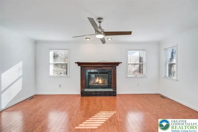 a view of staircase with wooden floor and a chandelier