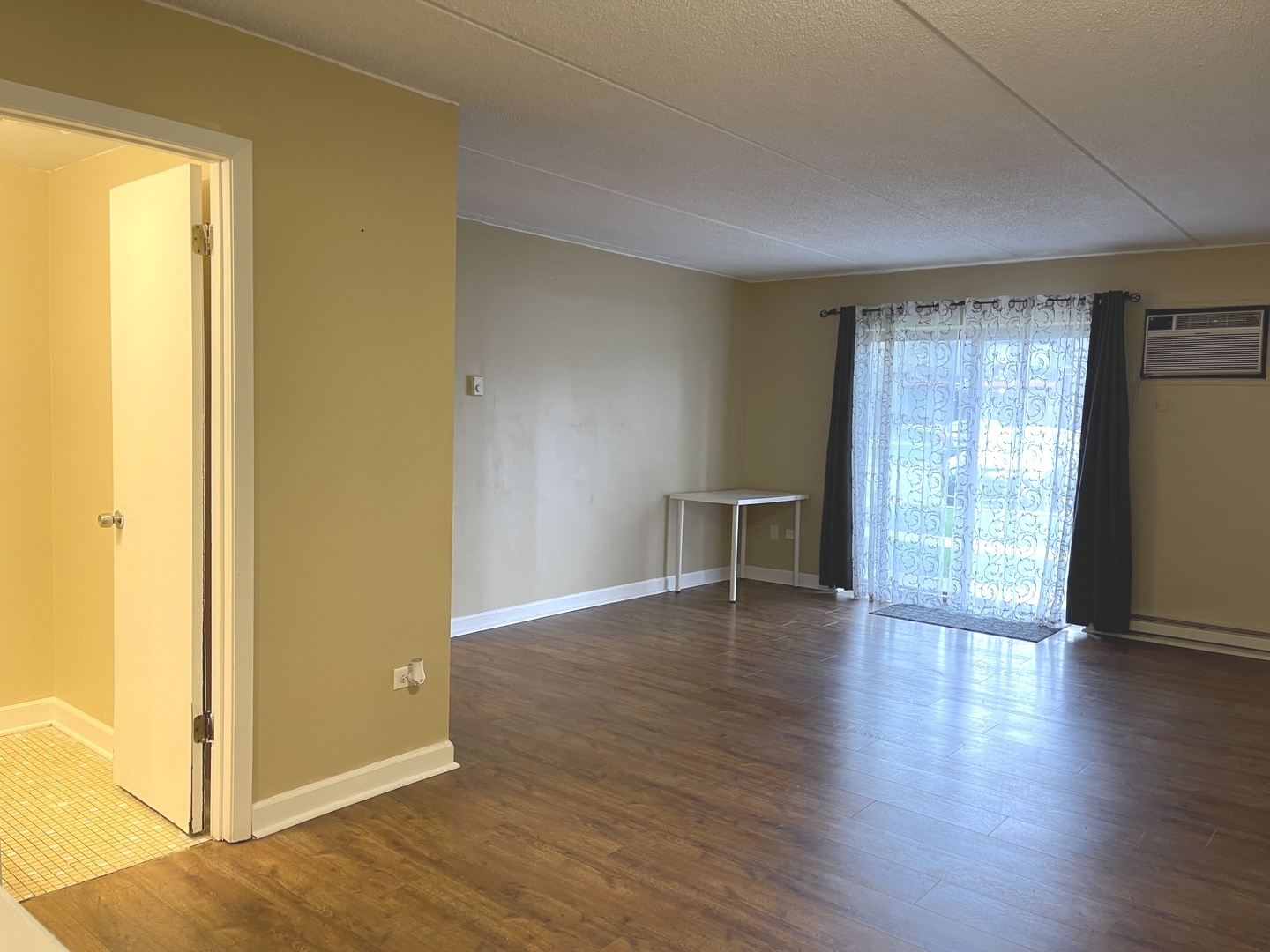 964 North Rohlwing Road, Unit GB Addison, IL 60101 - Photo 8 of 27 an empty room with wooden floor and windows