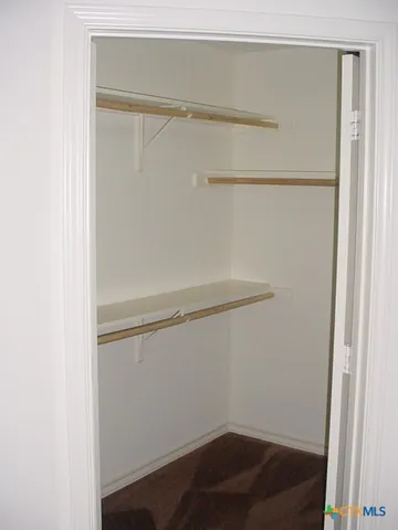 a view of a hallway with a window