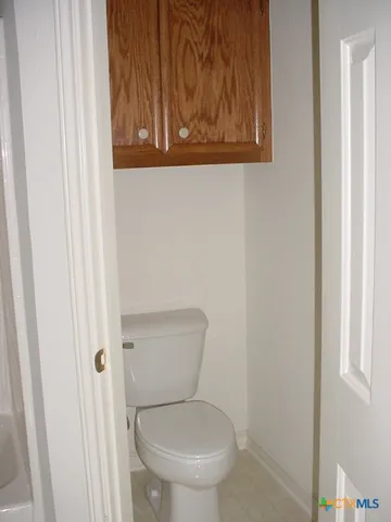 a bathroom with a shower and a sink