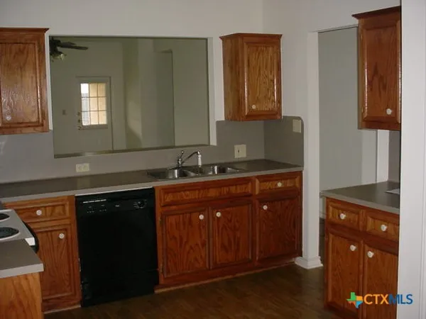 a kitchen with a stove and a sink