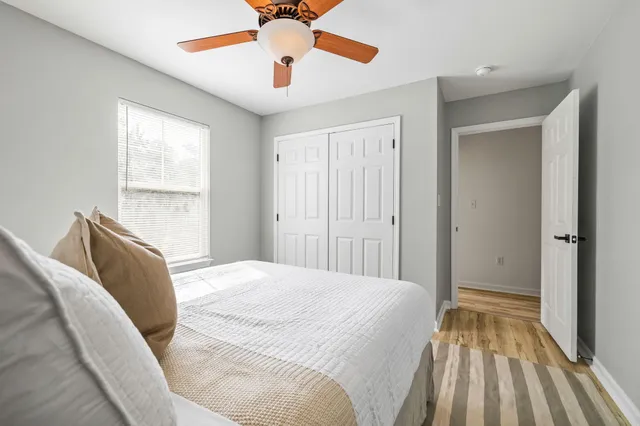 a bed room with a bed and a window