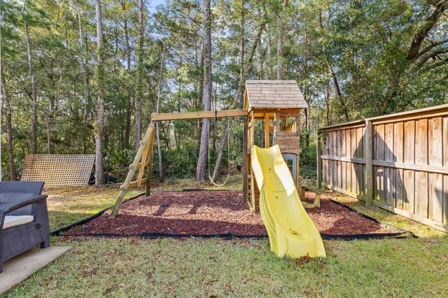 a view of a backyard with a small deck