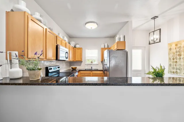 a large kitchen with a large window and counter space