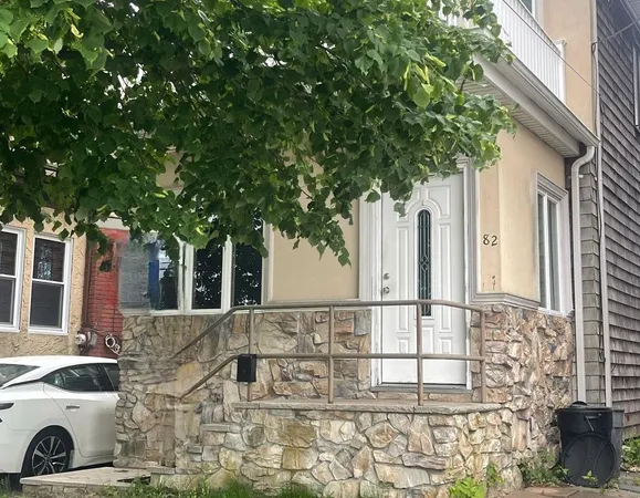 a view of a house with a tree