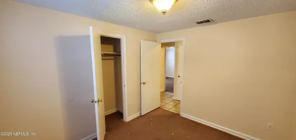 a view of a hallway with closet