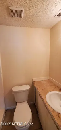 a bathroom with a toilet and a sink