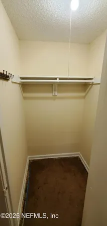 a view of small space with racks on the wall