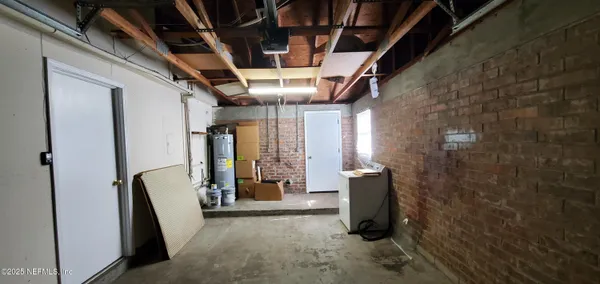 a view of a hallway with wooden walls and stairs