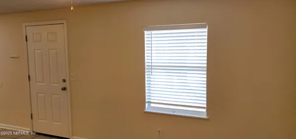 a view of a bathroom and a window