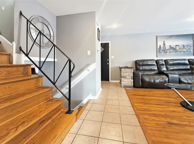 a very nice looking room with wooden floor and furniture