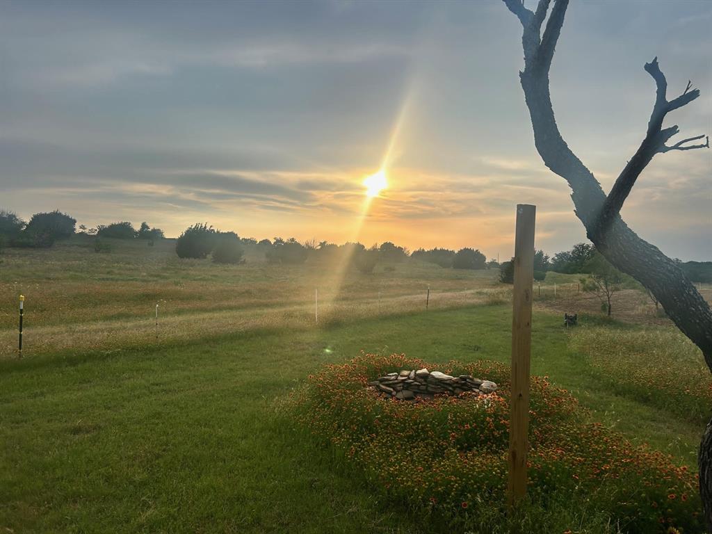2592 County Road 610 Hamilton, TX 76531 - Photo 1 of 23 a view of a lake from a yard