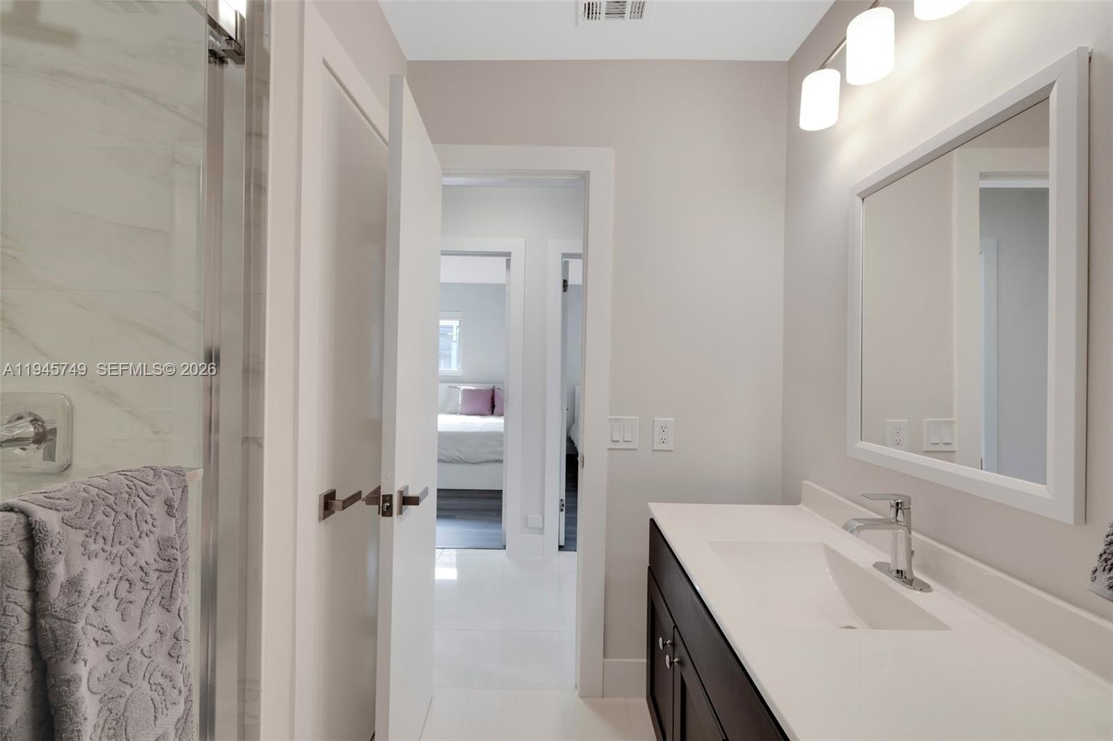 3500 North Park Road Hollywood, FL 33021 - Photo 19 of 39 a en suite bathroom with a sink double vanity and a mirror