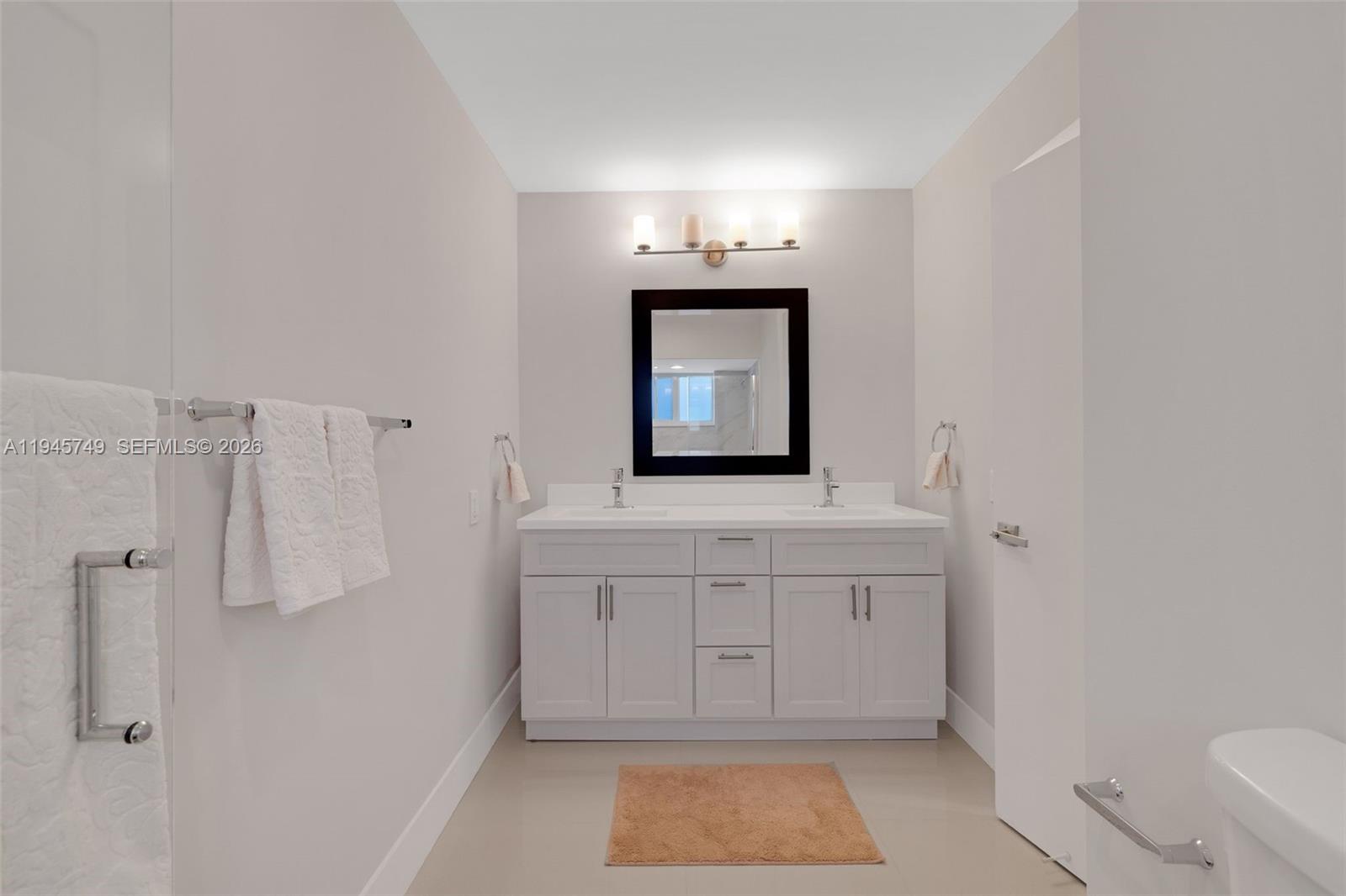 3500 North Park Road Hollywood, FL 33021 - Photo 22 of 39 a bathroom with a sink a toilet and mirror
