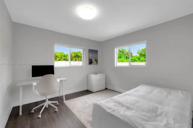 a workspace with furniture and a window