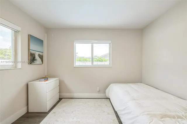 a room with a bed and a window