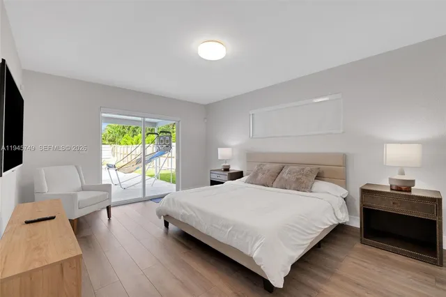 a bedroom with a bed and a couch