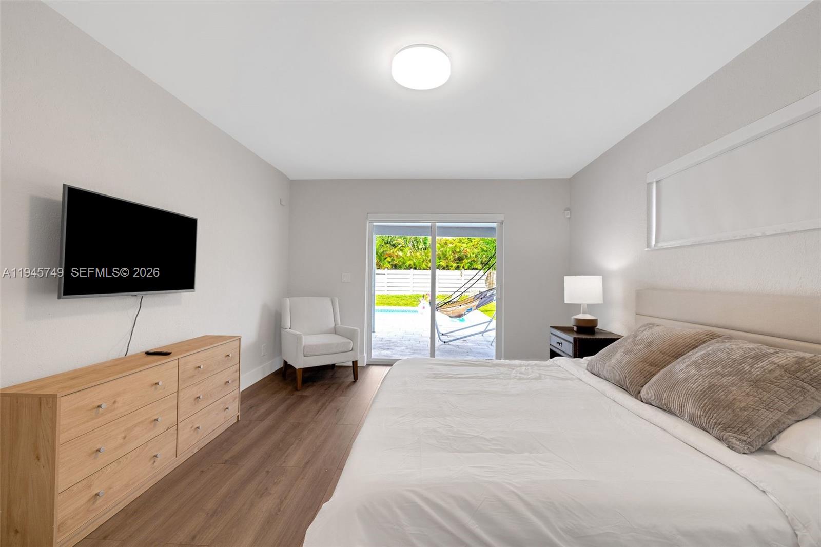 3500 North Park Road Hollywood, FL 33021 - Photo 30 of 39 a bedroom with a bed and a flat screen tv