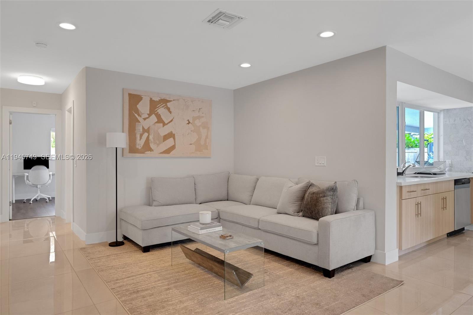 3500 North Park Road Hollywood, FL 33021 - Photo 3 of 39 a living room with furniture and painting on the wall