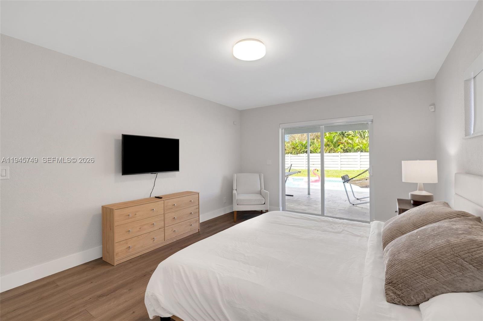 3500 North Park Road Hollywood, FL 33021 - Photo 31 of 39 a bedroom with a bed and a flat screen tv