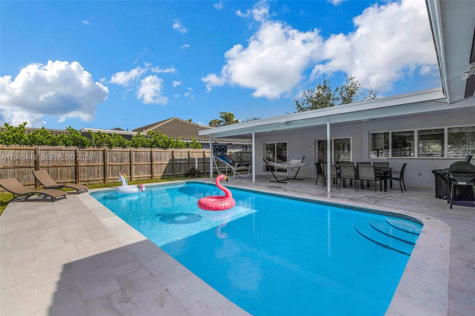 3500 North Park Road Hollywood, FL 33021 - Photo 34 of 39 a view of a backyard with swimming pool and furniture