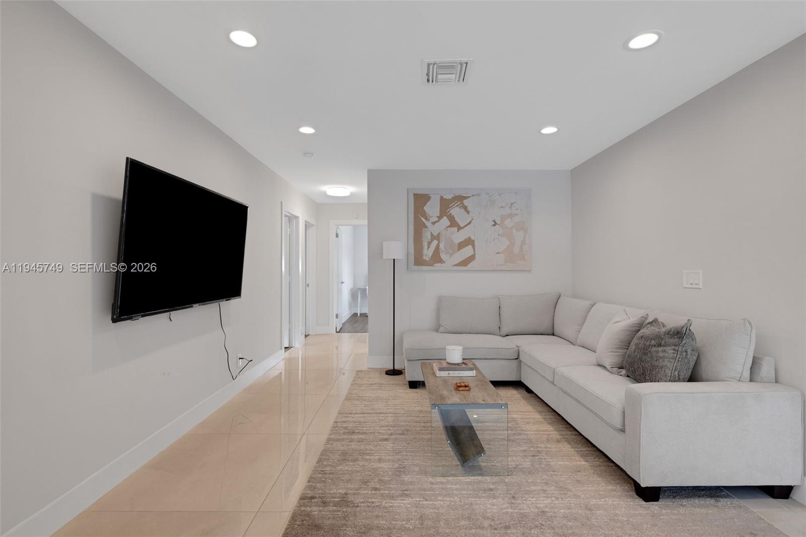 3500 North Park Road Hollywood, FL 33021 - Photo 4 of 39 a living room with furniture and a flat screen tv