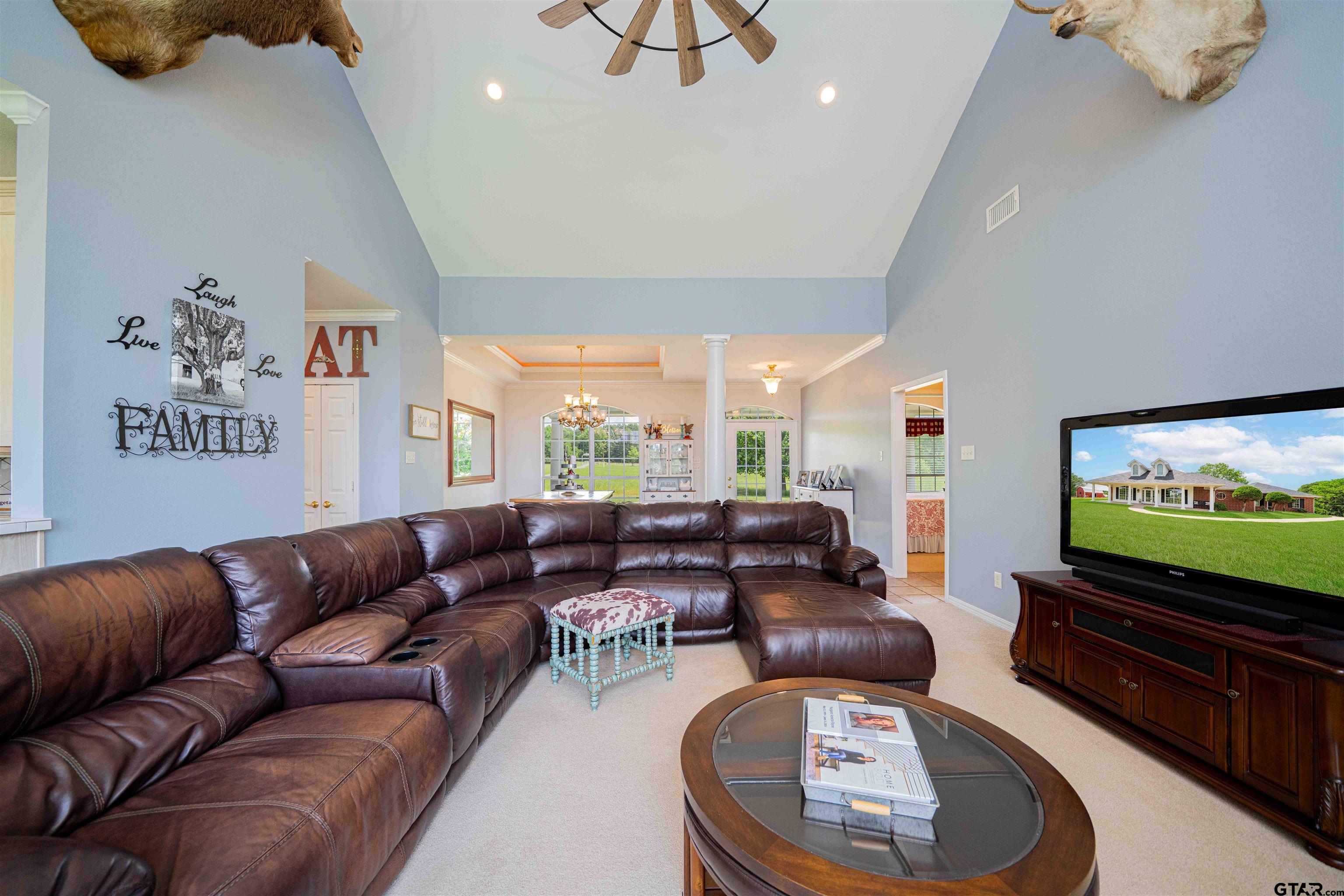 1855 Phillips Springs Road Gladewater, TX 75647 - Photo 3 of 36 a living room with furniture and a flat screen tv