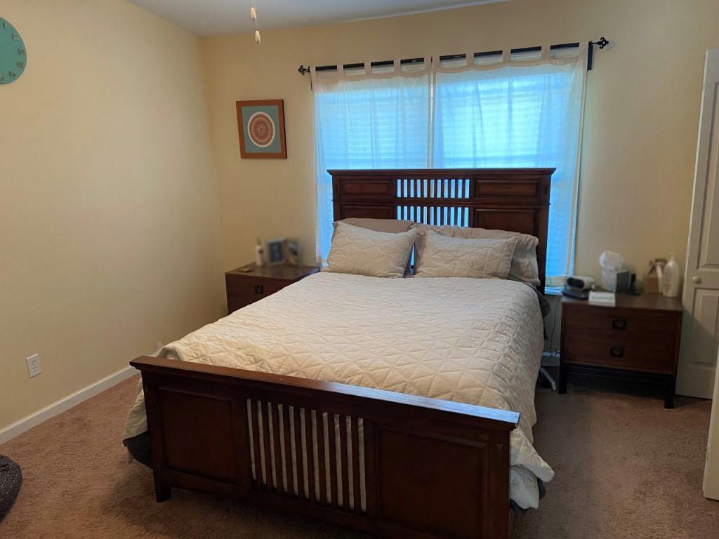 232 Epps Bridge Road, Unit 1A Athens, GA 30606 - Photo 8 of 14 a bedroom with a bed and a window